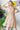 Model wearing Floral Ruffled V-Neck Dress, front.