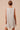 Back view of bow print mini dress with flared silhouette