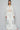Model view of white crochet shirt styled with denim for casual boho look