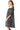 Side view showcasing the chic off-shoulder and tied sleeve details.