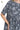 Close-up of floral print and peplum hem, showing quality stitching and soft fabric.