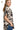 Side view of two-tone shirt, showcasing high-low hem and modern fit.