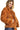 Side view of brown fuzzy jacket highlighting the cozy fabric and flattering fit.