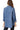 Back view of the denim shacket, featuring the clean, structured back design.