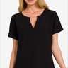 Elegant woman in a casual black v-neck t-shirt with short sleeves.