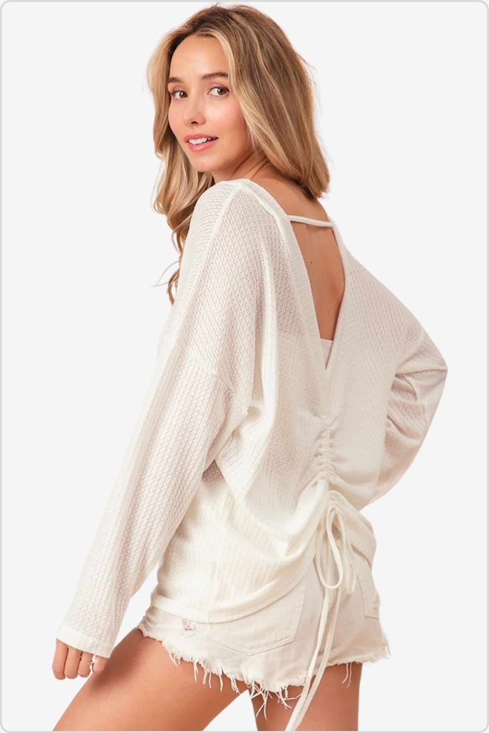 Woman in casual white waffled backless top with drawstring detail and denim shorts, Color Off White