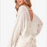 Woman in casual white waffled backless top with drawstring detail and denim shorts, Color Off White