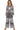 Full outfit featuring floral knit top paired with wide-leg pants for a stylish and relaxed ensemble.