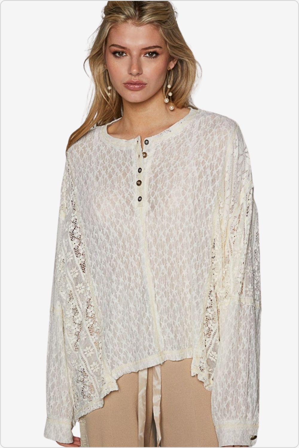 Elegant front view of a woman wearing a lace-detail long sleeve top, perfect for versatile styling, Color Cream