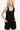 Woman in a trendy shoulder knot baggy romper, perfect for a relaxed yet stylish look, Color Black