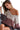 Close-up of the color block and contrast stitching details on the top.