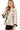 Side view of women's babydoll blouse in Cream, emphasizing the tie front and flowy silhouette.
