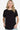 Woman in a black round neck t-shirt with crisscross sleeve detail.
