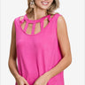 Woman in pink cutout neck sleeveless top smiling