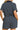 Back view of women's half-zip striped romper, emphasizing the relaxed fit and flattering cut.