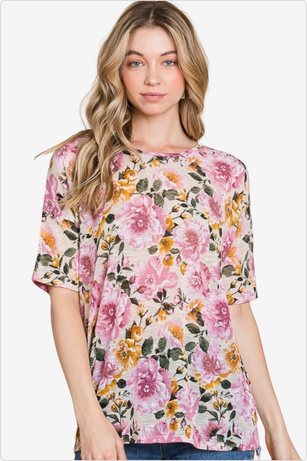 Stylish woman wearing a floral round neck t-shirt, perfect for casual or dressy occasions, Color Sand