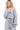 Front view of the Gray Drawstring Jumpsuit, showcasing its boat neck and tailored fit.