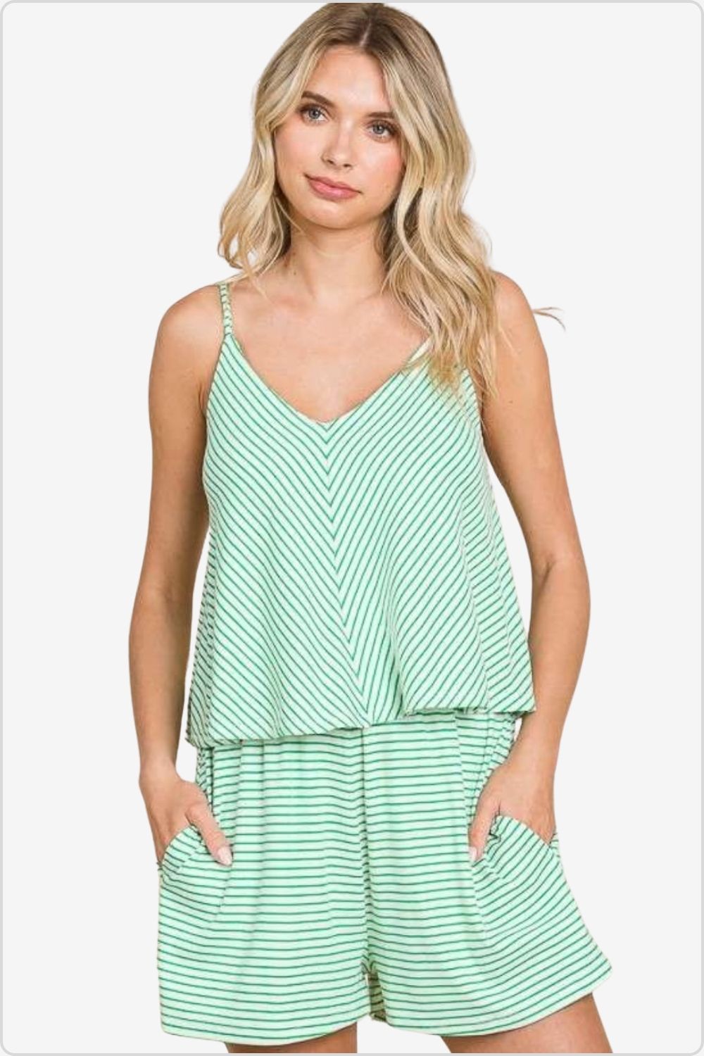 Woman in green double flare striped romper with v-neck.