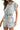 Side profile of denim romper highlighting pockets and flattering fit.
