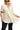 Women's oatmeal raw hem notched babydoll linen blouse, showcasing the relaxed fit and trendy neckline.