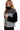 Side profile of plaid sherpa jacket highlighting the relaxed drop shoulder silhouette.
