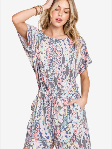 Stylish printed romper with drawstring waist and short sleeves, ideal for summer.