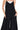 Women's black wide-leg overalls, front view showcasing spaghetti straps and relaxed fit.