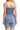 Back view of denim romper, showing seamless smocking and comfortable fit.