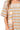 Close-up of star applique and cotton knit showing playful stitching and stripe design