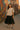 Striped tee styled with black tiered tulle skirt and silver ankle boots for bold evening look