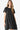Woman in a Swiss dot short sleeve tiered dress