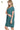 Side view of teal pocket dress, highlighting comfortable fit and soft fabric.