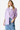 Stylish model wearing Raw Hem Button-Up Long Sleeve Shirt, front view.