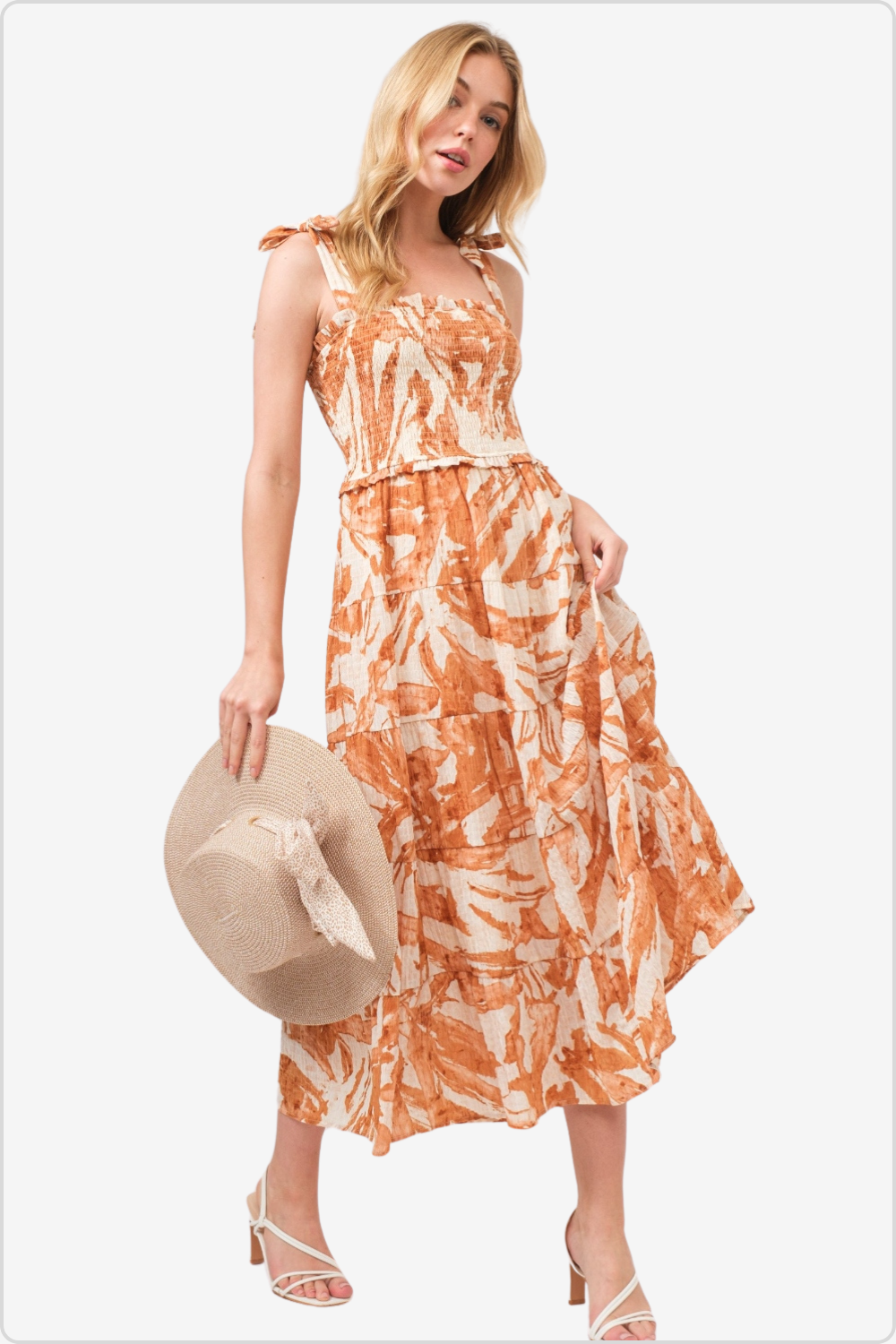 Elegant smocked midi tiered dress with tie shoulders for a summer look