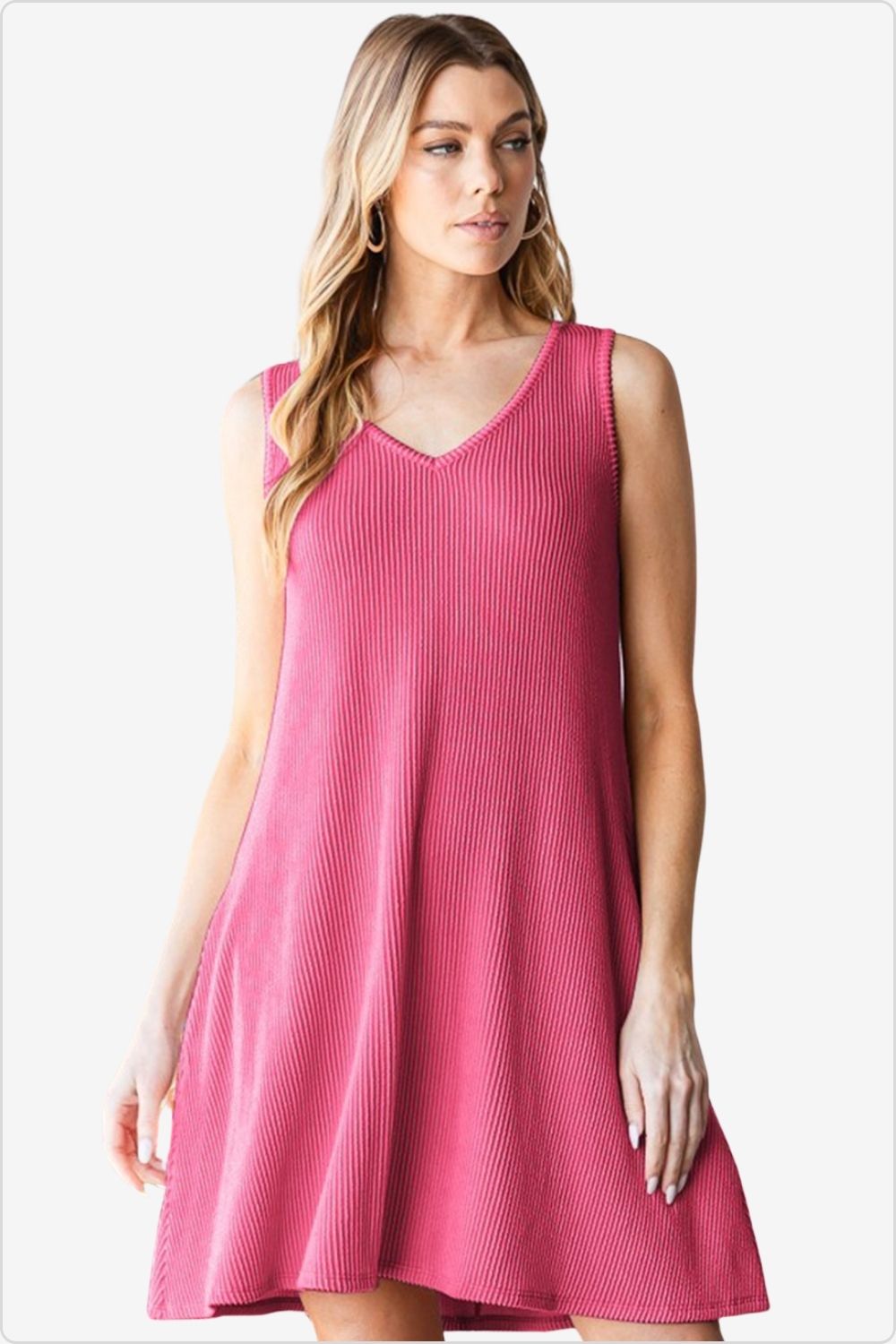 Woman in chic V-neck ribbed mini tank dress, perfect for summer.