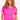 Cheerful woman modeling a vibrant pink short-sleeved cable knit top, Color Fuchsia