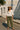 White eyelet peplum blouse styled with olive green cargo pants and straw hat