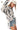 Side view of printed shirt, showcasing modern high-low hem.