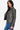Side view of Black Biker Jacket featuring sleek lines and a belted waist for a fitted look.