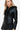 Side profile of a women's faux leather jacket with zippered pockets and a contoured fit.