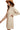 Side view of turtleneck sweater dress highlighting relaxed fit and color block style.