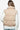 Back view of the beige quilted vest, showing the puffer design and smooth texture.