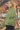 Side view of the green plaid jacket with a relaxed fit and functional buttons, ideal for layering.