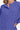 Close-up front view of women's brushed melange high-low sweater with 7-button Henley placket.
