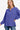 Stylish front view showcasing high-low hem and Henley buttons on the blue women's sweater.