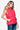 Side profile of the magenta vest showing its sleek fit and side pocket.