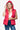 Woman wearing a bright magenta hooded puffer vest with snap and zip closure.