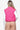 Back view of the hot pink vest, showcasing the quilted pattern and collar.