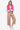 Vibrant hot pink quilted vest on a model, highlighting the snap-button closure.