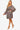 Side view of Women's V-Neck Satin Floral Layered Dress showcasing flowy fabric and ruffled layers.